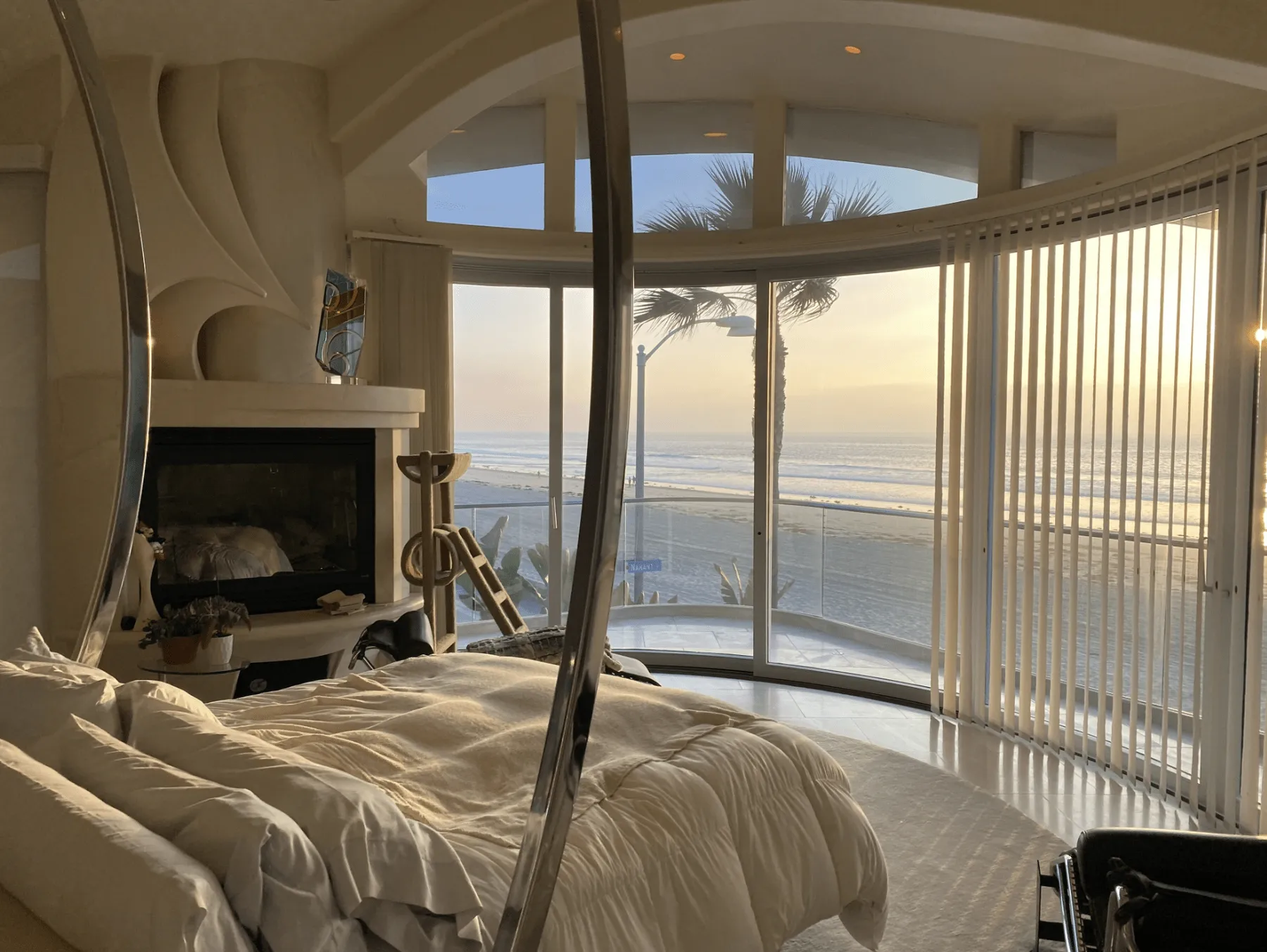 Motorized shades in a bedroom with an ocean view